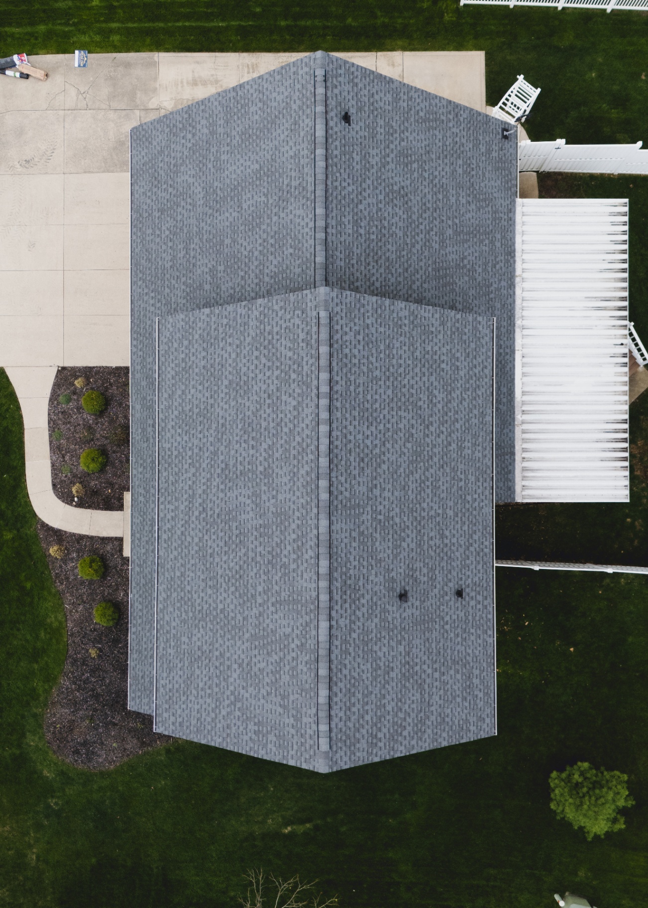 Overhead top-down aerial of the completed Pewter Gray GAF Timberline HDZ field on the brick colonial — Whispering Pines, Bellefontaine, Ohio GAF certified roof replacement by Peak One Restorations